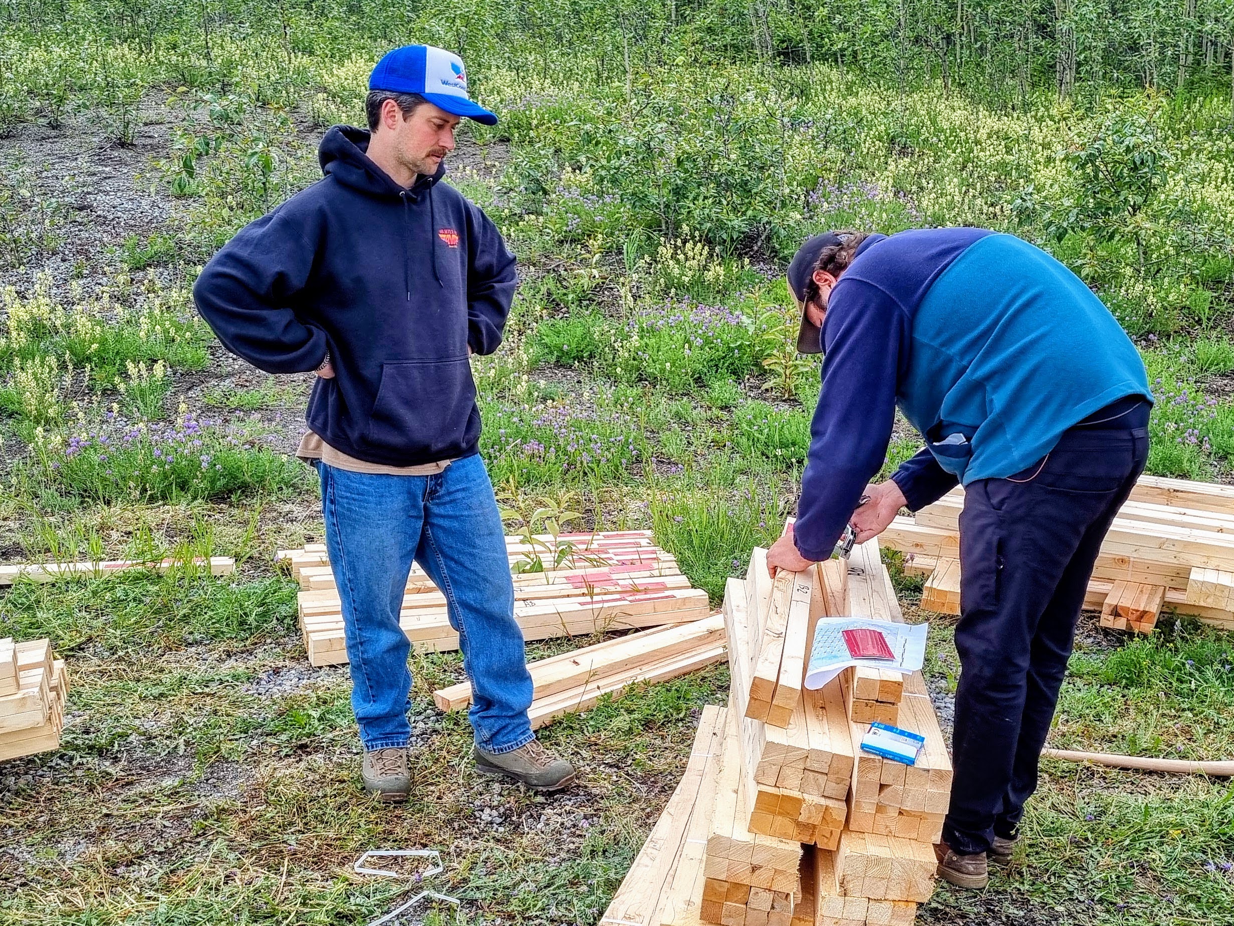 Crew preparing quartz claim posts for a large staking program